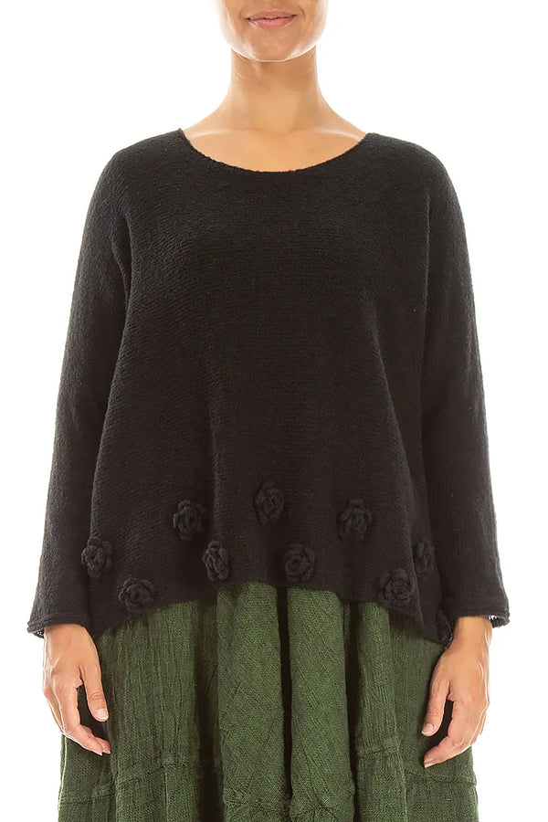 Pull noir en laine à motifs floraux