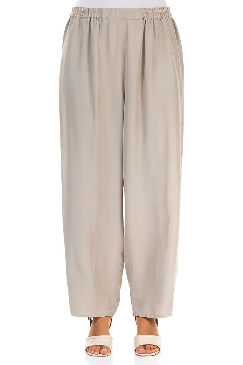 Pantalon fuselé beige en pure soie