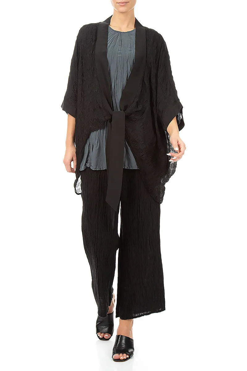 Veste en soie noire texturée à nouer