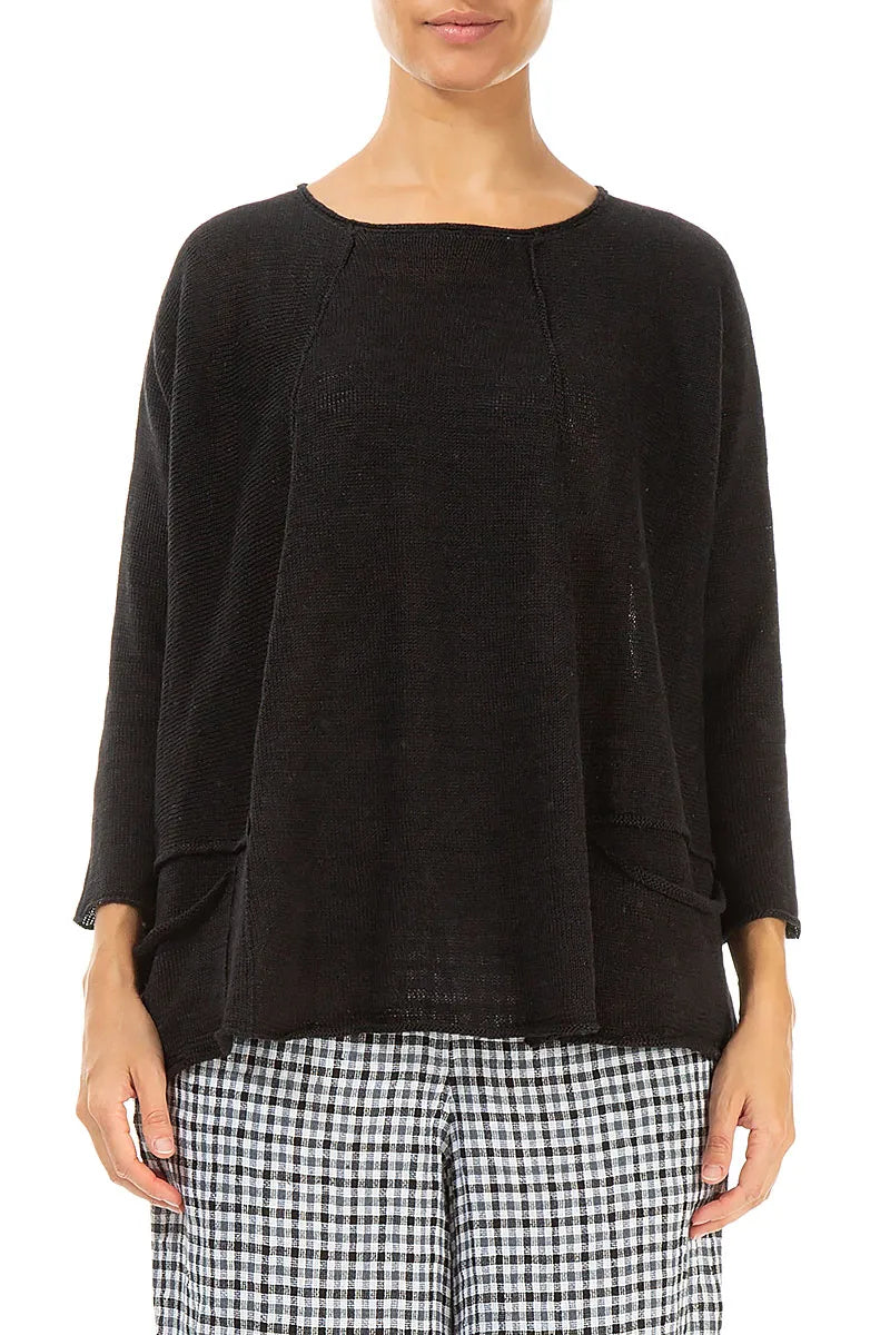 Pull en lin noir à deux poches et coupe trapèze