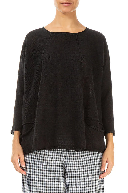 Pull en lin noir à deux poches et coupe trapèze