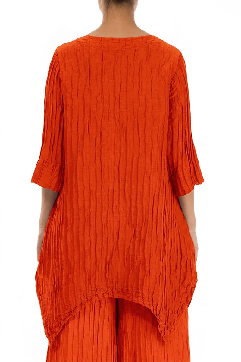 Asymmetrische gekreppte Tunika aus flammenoranger Seidenleinenmischung