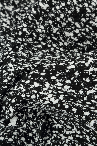 Pantalon boutonné en coton moucheté noir et blanc