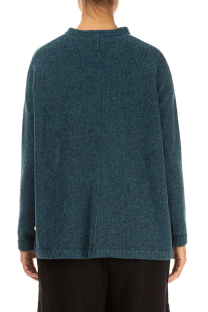 Gilet en laine turquoise à col volanté