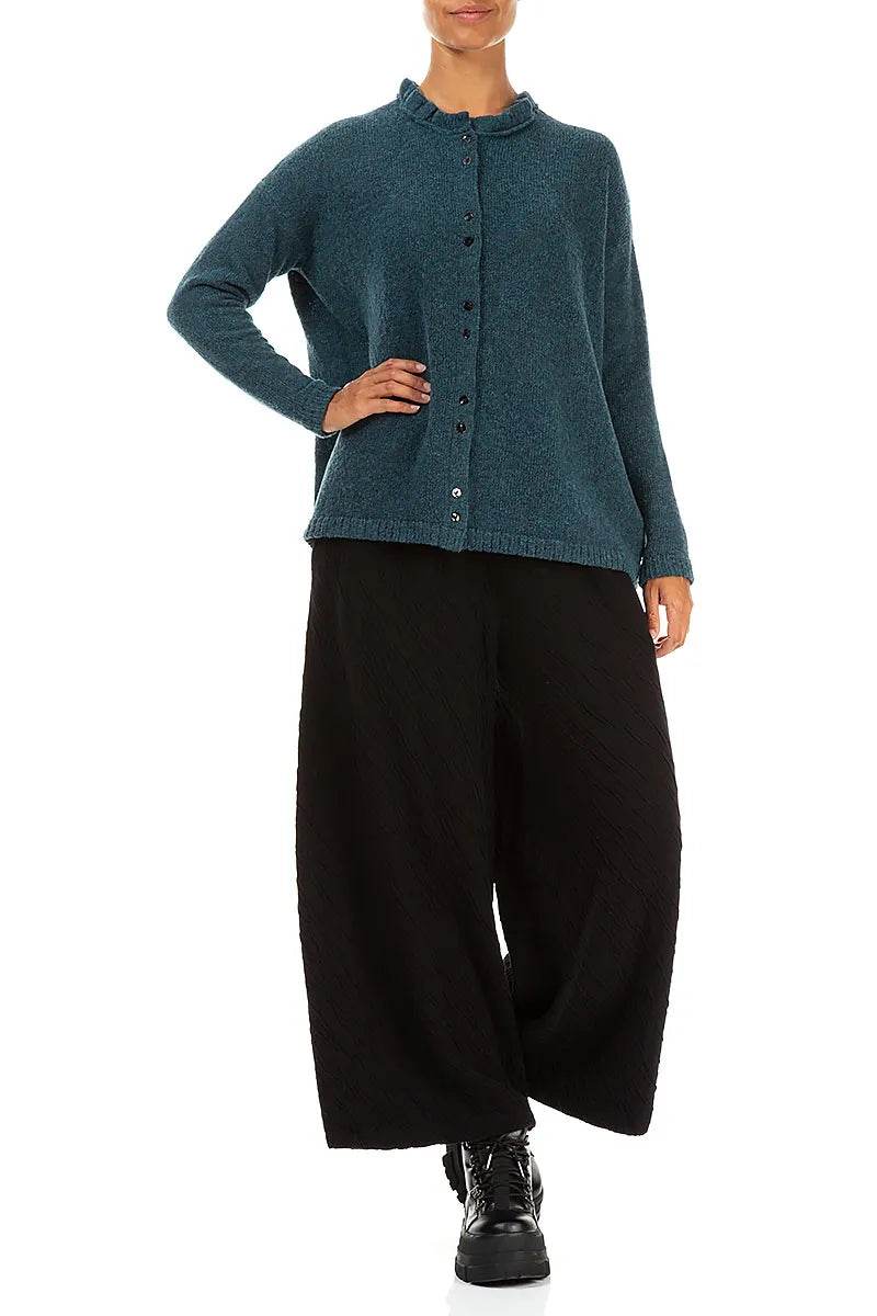 Gilet en laine turquoise à col volanté