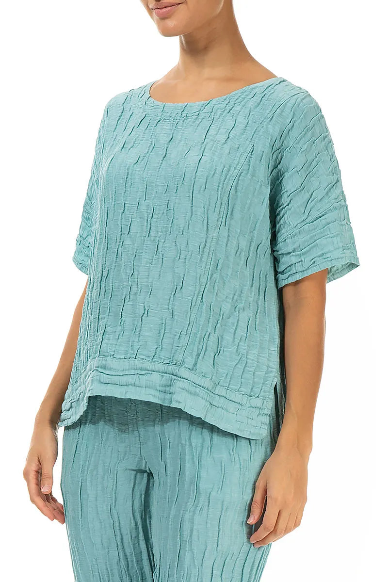 Bluse aus mintfarbenem Seidenleinen mit horizontalem Saum und Knittereffekt