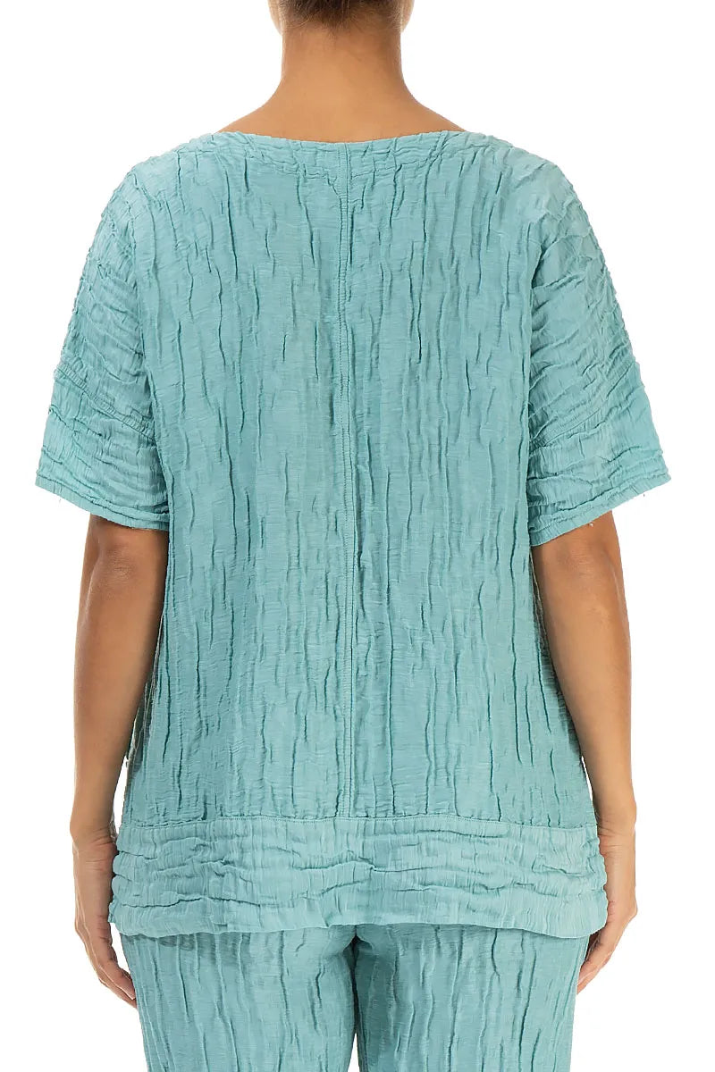 Bluse aus mintfarbenem Seidenleinen mit horizontalem Saum und Knittereffekt
