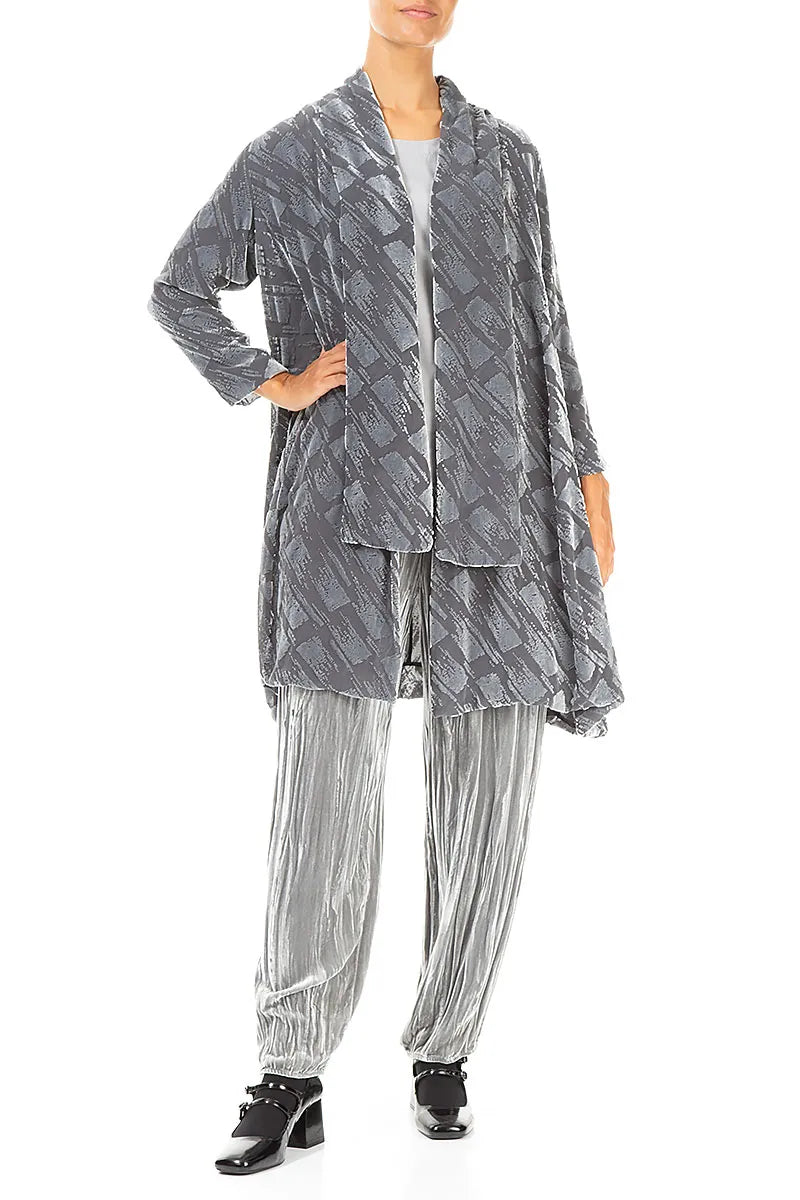 Person wearing a gray patterned outfit on a white background