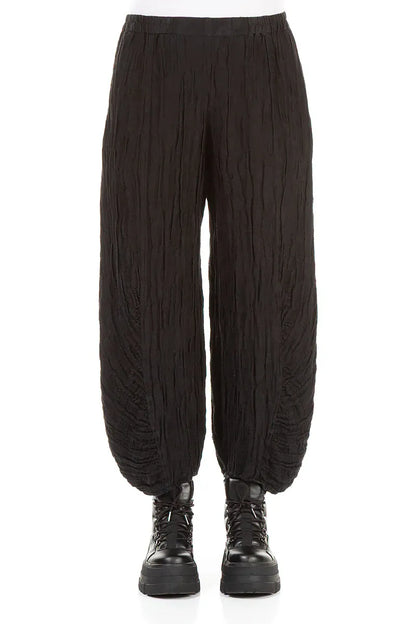 Pantalon en lin et soie noir à ourlet froncé