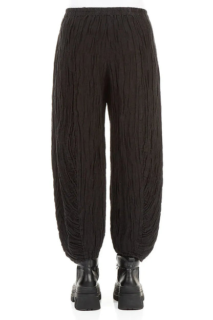 Pantalon en lin et soie noir à ourlet froncé