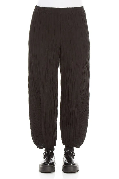 Pantalon en lin et soie froissé noir à ourlet froncé