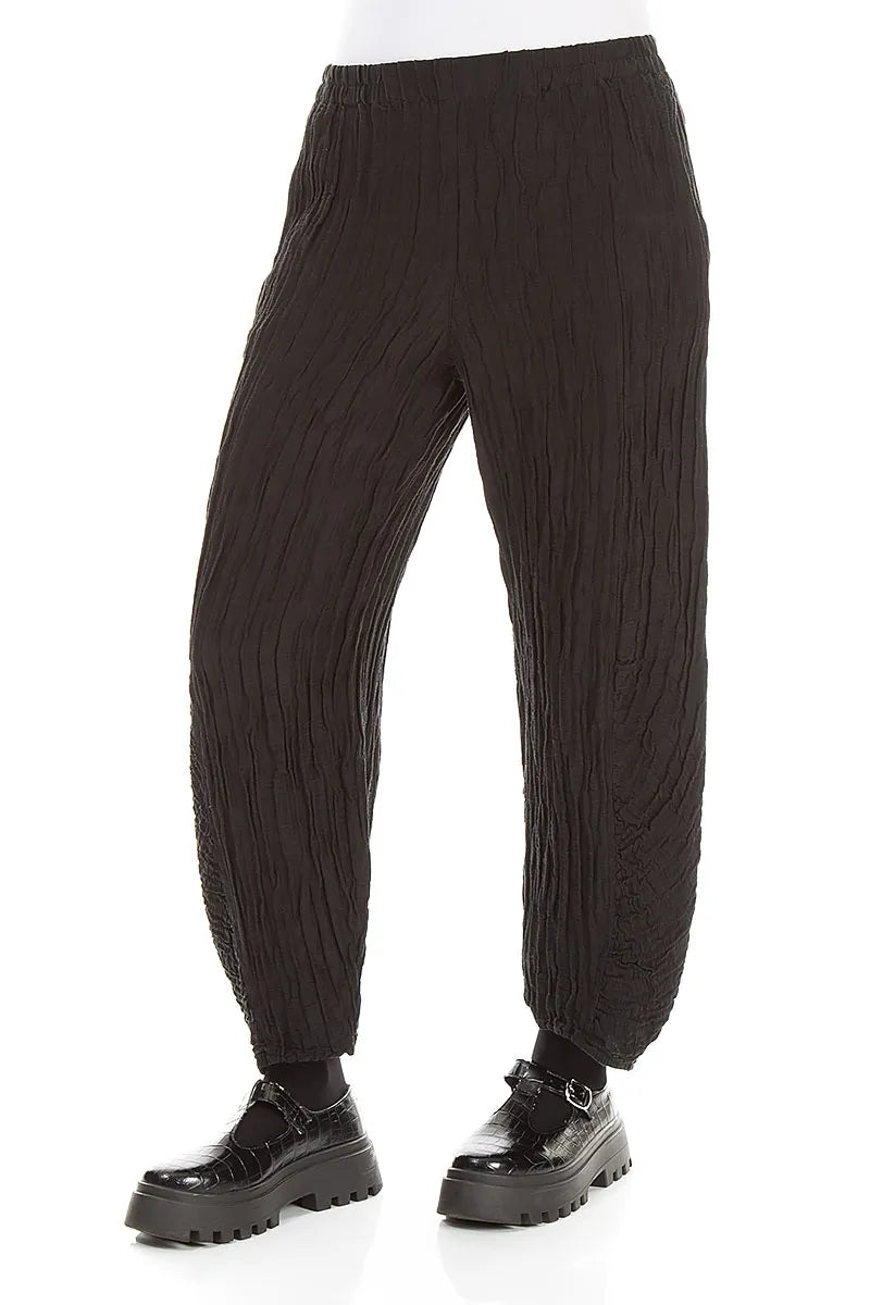 Pantalon en lin et soie froissé noir à ourlet froncé