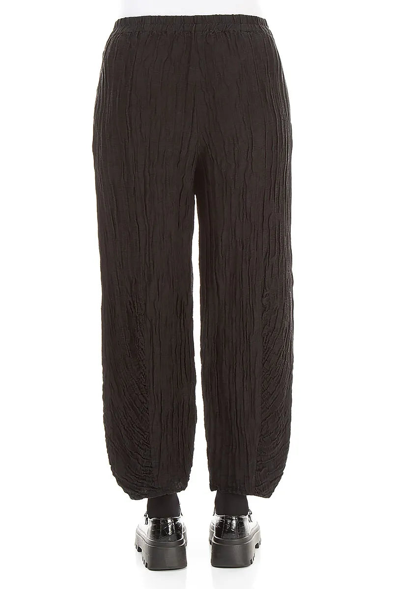 Pantalon en lin et soie froissé noir à ourlet froncé