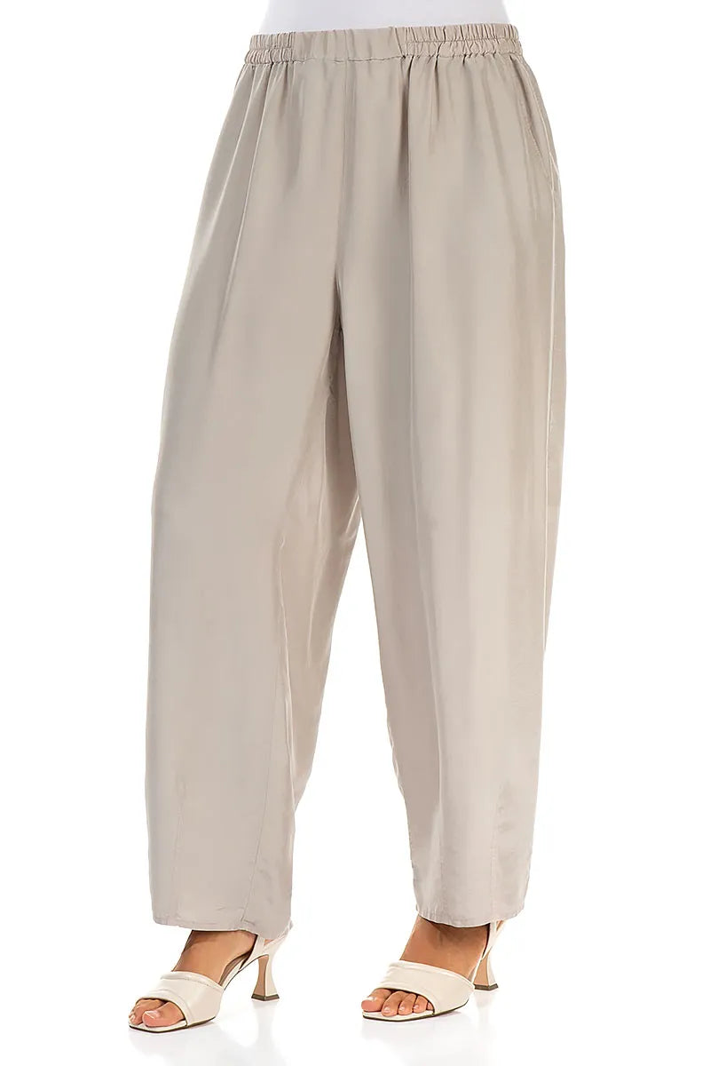 Pantalon fuselé beige en pure soie