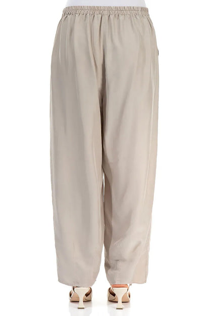 Pantalon fuselé beige en pure soie