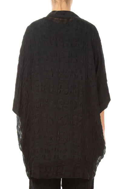 Veste en soie noire texturée à nouer