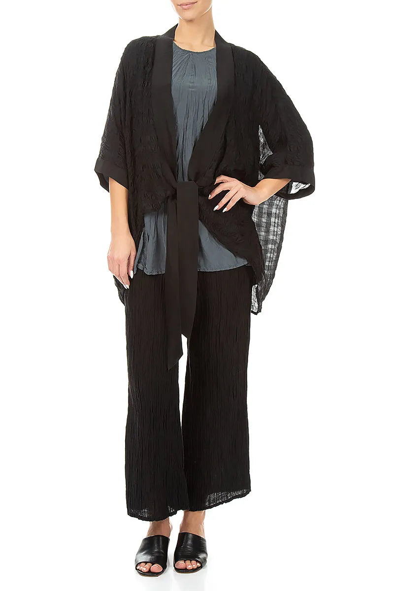 Veste en soie noire texturée à nouer
