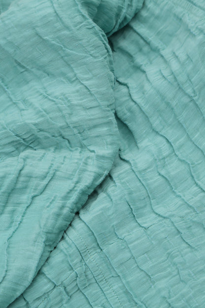 Robe en soie et lin froissés menthe à deux poches