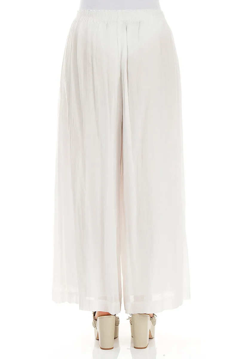 Pantalon large froissé en coton blanc cassé